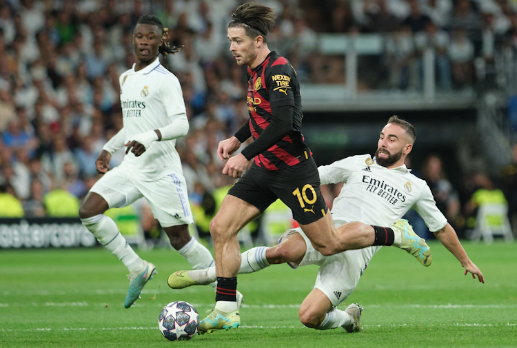 Manchester City midfielder Jack Grealish (C) in action with Real Madrid's Dani Cavajal during a Uefa Champions League semifinal first leg in Madrid, Spain on May 9