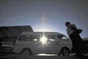 DEATH TRAPS: A woman about to catch a taxi at a rank.  Photo: Gallo Images