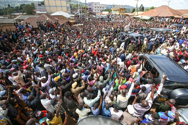 Kisii residents welcome President William Ruto who is set to commissioning of several projects including the launch of the construction of Gamba-Kegogi Road in Kisii county on March 24, 2023.