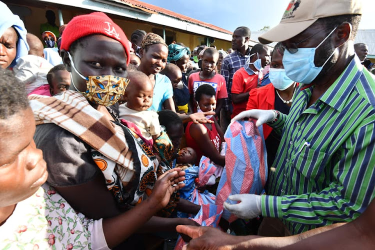 Kisumu Governor Anyang Nyong'o with flood victims in Nyakach subcounty