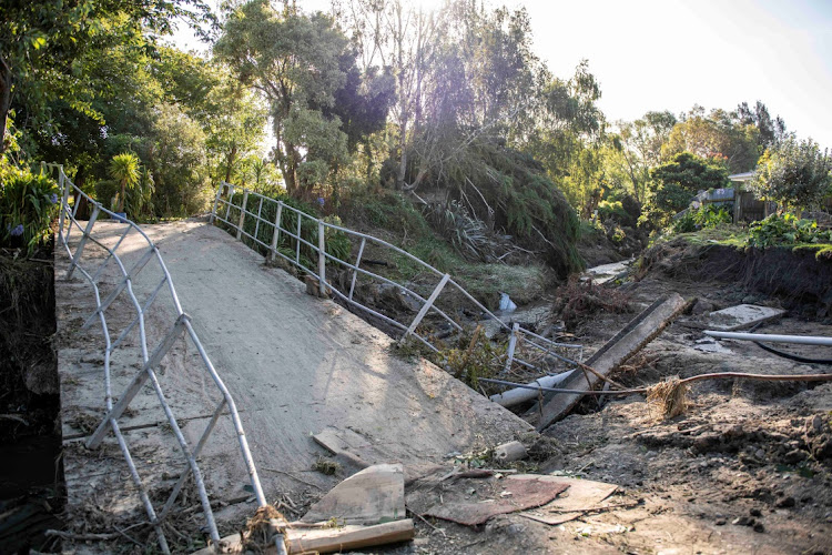 A damaged bridge after a small creek bursts its bank, causing houses to flood in Havelock North, New Zealand, on February 18 2023.