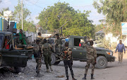 Force members loyal to former Police Commander Sadaq Omar Hassan, also known as Sadaq John, gather with their equipment in the Black Sea area of Hodan district, in Mogadishu, Somalia April 17, 2021