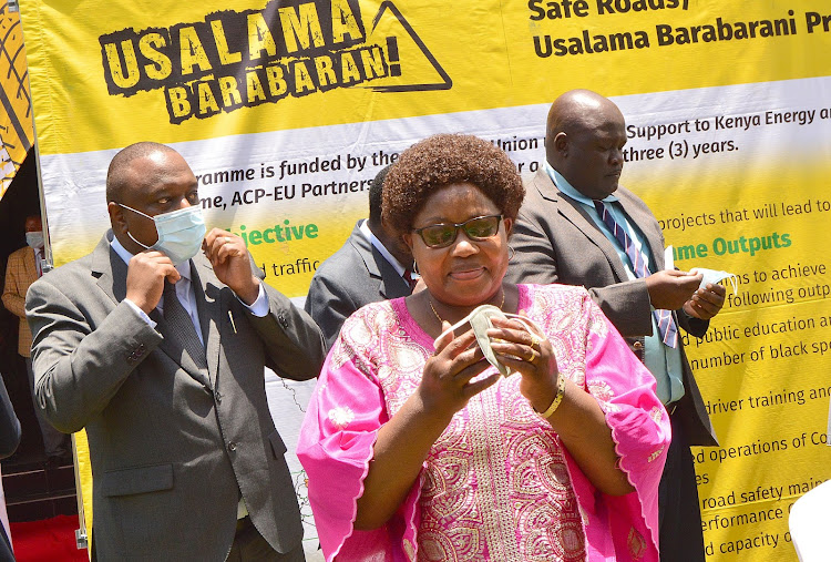 NTSA director general George Njao, board chairperson Agnes Odhiambo and other officials in Kakamega on Thursday