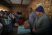 eThekwini mayor Mxolisi Kaunda visits the family of Thulani Mpithimpithi, one of seven people shot dead on Saturday.