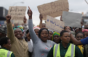 Protesters outside the Estcourt Magistrate's court on Monday, 8 August. Five men are facing charges of murder‚ conspiracy to commit murder and attempted murder after a man walked into an Estcourt police station and said he was tired of eating human flesh.