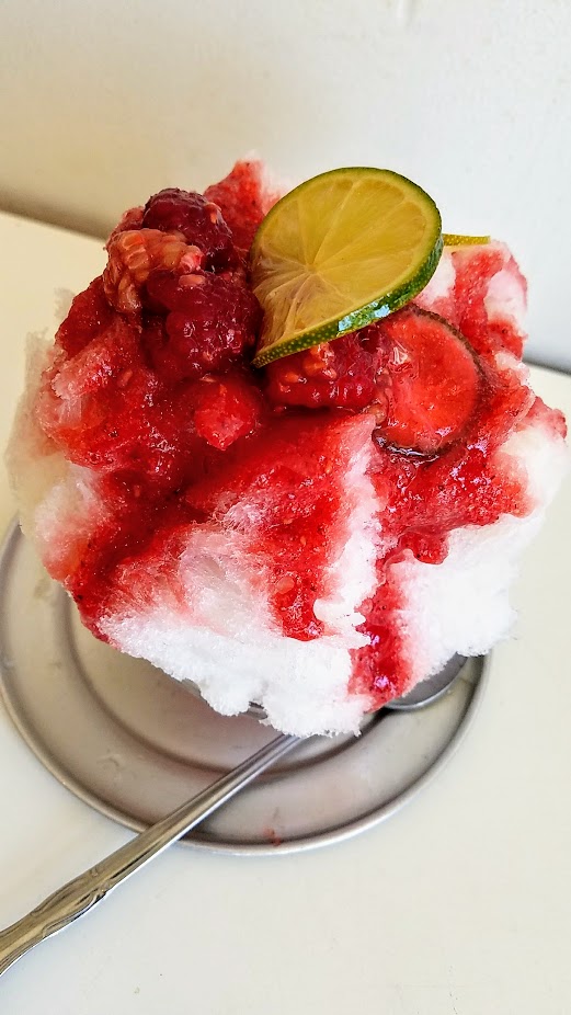 Ssshaved Ice, a pop up offering Japanese Shaved Ice Raspberry Special, Raspberry syrup from Groundworks organic raspberries at today's Farmer's Market, condensed milk, and garnished with lime