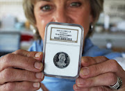 Avid collector Arlene Beneke with one of her other Mandela coins.