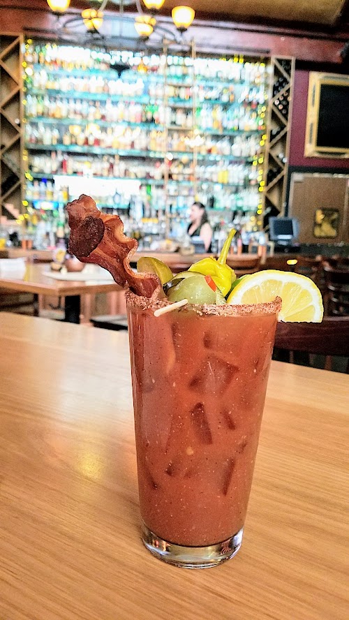 Circa 33 brunch, Bloody Mary c.1921 with vodka, summer-spiced bloody blend, creole-salt rim and choice of bacon/veggie/combo garnish