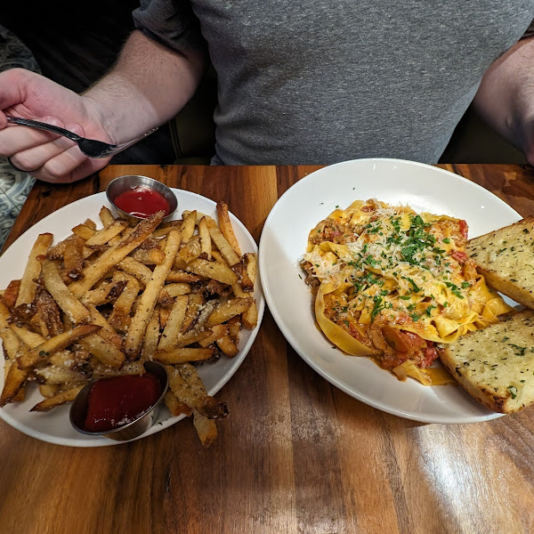 Gluten free Parmesan truffle fries and not gluten free Bolognese pasta (but they do offer a gluten free version of this dish).