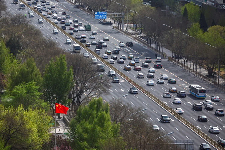 A vehicle of a motorcade, believed to be carrying French President Emmanuel Macron, makes its way through Chang'an Avenue, in central Beijing, China April 6, 2023.