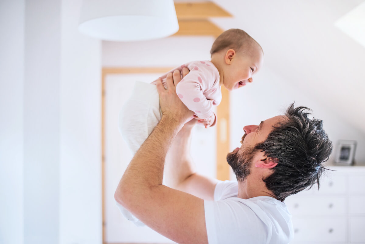 FMLA Ohio: father carrying his baby