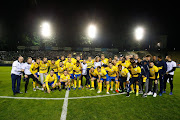 Bafana Bafana and Royal Union St Gilloise star forward Percy Tau is seen wearing a leg brace in a group picture with his teammates. 