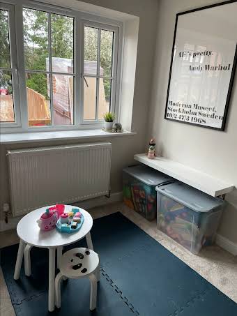 Garage conversion into a kid's playroom album cover