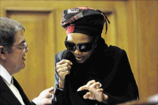 AWAITING SENTENCING: Thandi Maqubela talks to Advocate Thomas Taylor at the Western Cape High Court in Cape Town Photo: SHELLEY CHRISTIANS