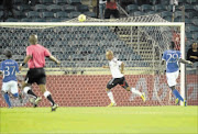 DECIDER: Oupa Manyisa of Orlando Pirates scores during their Absa Premiership match against  SuperSport United at Orlando Stadium in Soweto last night.  Photo: Gallo Images