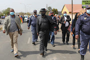 Police minister Bheki Cele arrives in Eldorado Park, where he met family of 16-year-old Nathaniel Julius, who was shot dead this week.