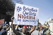 OUTRAGE: People march to the Nigerian consulate in Illovo, Joburg, to hand over a memorandum in support of the Bring Back Our Girls campaign to rescue more than 200 girls kidnapped by Boko Haram in Nigeria. Picture: Lauren Mulligan