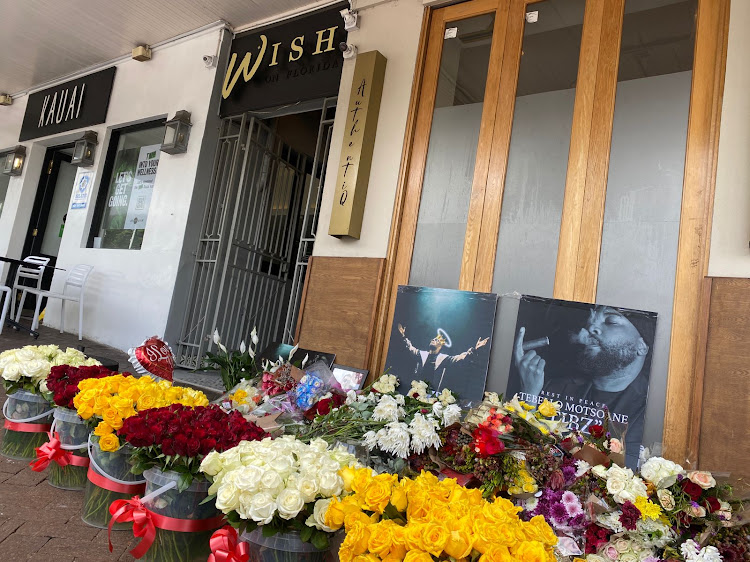 People continue to lay flowers outside Wish on Florida in Florida Road, Durban, where award-winning rapper AKA was gunned down.