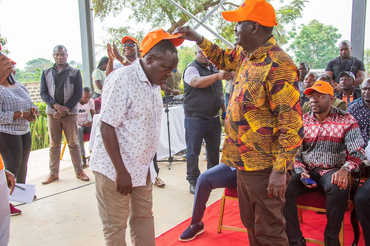 Azimio leader Raila Odinga receives Bungoma politician Majembe Machanja to the Orange Democratic Movement on January 17, 2023.