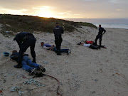 Some of the six men who appeared in Blue Downs magistrate's court charged with murder on April 2 2020 are arrested on Tuesday at Strandfontein beach, Cape Town.