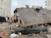Rescue workers survey the damage after an earthquake devastated parts of Turkey and northwest Syria.