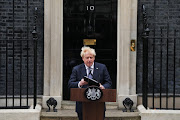 UK Prime Minister Boris Johnson walks to address the nation as he announces his resignation outside 10 Downing Street on July 7, 2022 in London, England. 