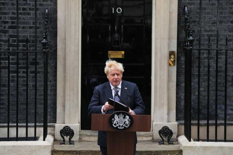 UK Prime Minister Boris Johnson walks to address the nation as he announces his resignation outside 10 Downing Street on July 7, 2022 in London, England.