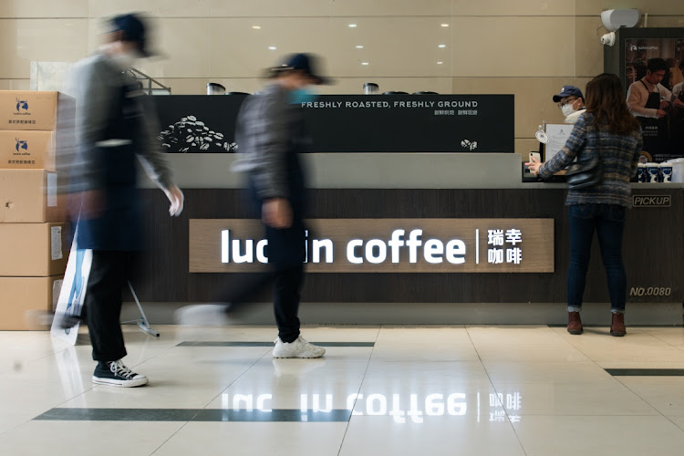 Clerks wear protective masks at a Luckin Coffee shop on April 3 2020 in Shanghai, China. Picture: GETTY IMAGES/YVES DEAN