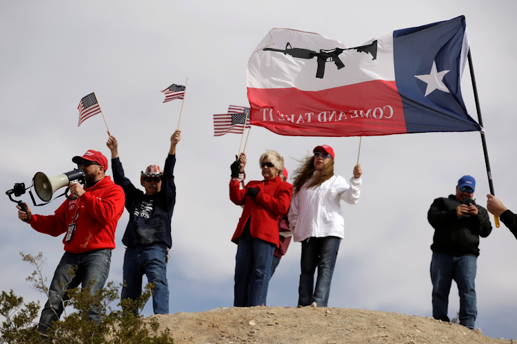 US demonstrators holding US flags gather at the open border to make a human wall in support of the construction of the new border wall between US and Mexico, in Ciudad Juarez, Mexico February 9, 2019.