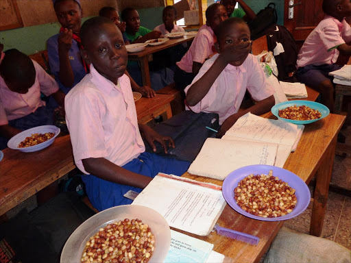 Students of Mikoroshoni Primary School in Mtwapa, Kilifi county, having lunch