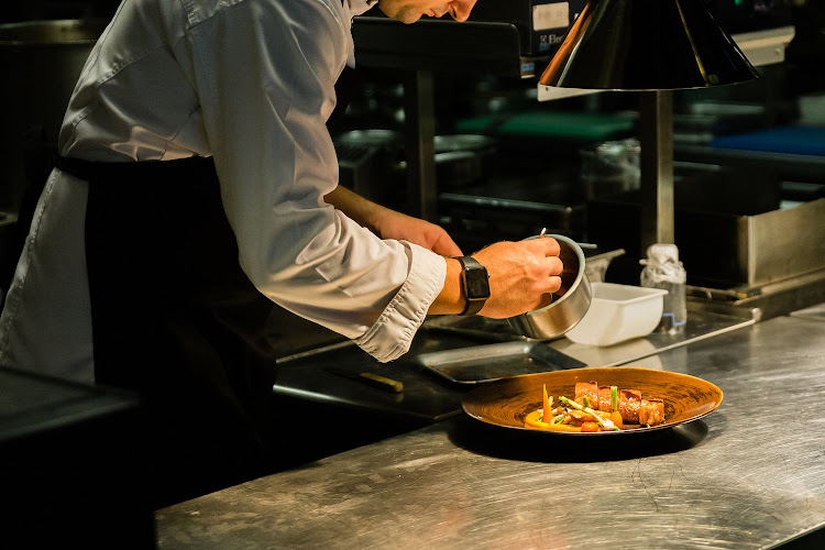 Chef preparing a delicious dish.