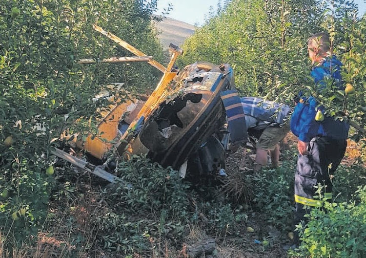 The wreckage of Stewart Graham's Bell Jet Ranger in a pear orchard on Silwerstroom farm in Wolseley, Western Cape.