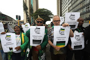 Supporters of former president Jacob Zuma protest outside the Olive Convention centre in Durban where the ANC provincial conference is being held