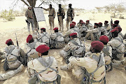 HOW TO DODGE A BULLET: A Spanish soldier trains Mauritanian special forces during Flintlock 2015, a US-led military exercise, in Chad last week