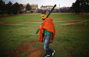 A masked protestor is seen on the lawns of The Union Buildings during a march by a group of Fees Must Fall protesters to the Union Buildings in Pretoria calling for free tertiary education.  In mid October 2015, a student led protest movement began in response to an increase in fees at South African universities. The Protests started at the University of Witwatersrand (Wits) and spread to various other universities including the University of Cape Town and Rhodes University. The rapid spread to other universities resulted in widespread damage and discontentment amongst the authorities. 