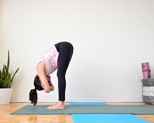 A person doing yoga on a mat

Description automatically generated with low confidence