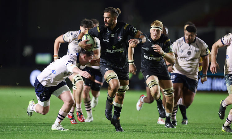 Sharks' Gerbrandt Grobler breaks away during the Challenge Cup match against the Dragons at Rodney Parade on January 21, 2024 in Newport, South Wales.