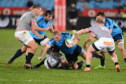 Luzuko Vulindlu (N0.12) of the Southern King tackles Adriaan Strauss of the Bulls during the Super Rugby match at Loftus Versfeld on July 08, 2017 in Pretoria, South Africa.