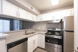 Kitchen with stainless steel appliances and white cabinets