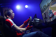 Baptiste Beauvois of France competes in the Nations Cup Grand Final during the Gran Turismo World Tour at Luna Park in Sydney, Australia, on February 16. 