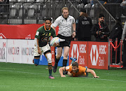 Ronald Brown of SA breaks free for a try against Australia on day 2 of the HSBC Canada Sevens at BC Place in Vancouver on April 17 2022.