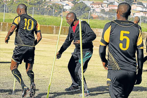 OUT OF THE BLUE: Coach Velile Dyaloyi, centre, was fired by Mthatha Bucks’ management yesterday in a shock decision Picture: FILE