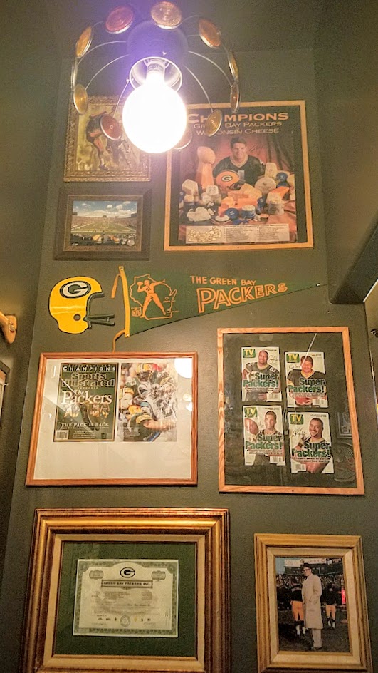 When you walk through that door of Saraveza, you immediately feel a bit like you're in a beer museum with all the retro beer paraphernalia all along the walls even on the way to the restrooms -one portion is a nod to owner Sarah's Wisconsin upbringing and how this is a Packers bar