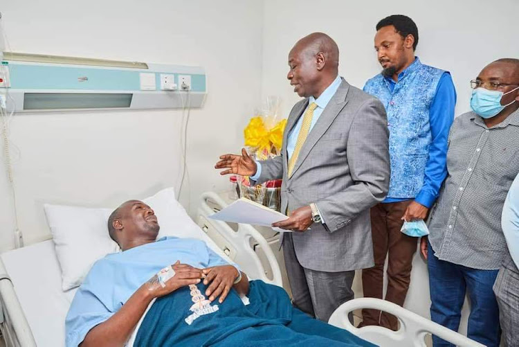 Deputy President Rigathi Gachagua with Senetor Karungo Thang'wa and Juja MP George Koimburi while visiting injured Juja OCS John Misoi at Avenue Hospital in Thika town on Tuesday.