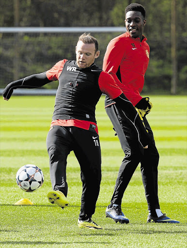 BACK ON THE FIELD: Manchester United's Wayne Rooney, left, and Danny Welbeck during practice yesterday. United and Bayern Munich start their Champions League quarterfinal second leg match today level at 1-1
