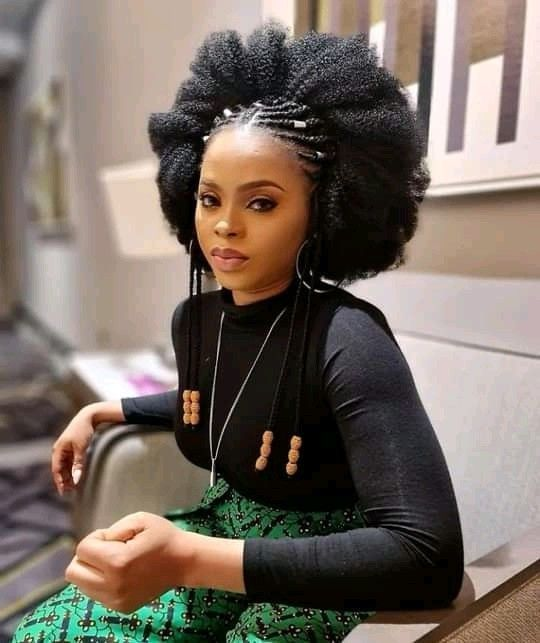 Chidinma rocking an afro hairstyle with beads