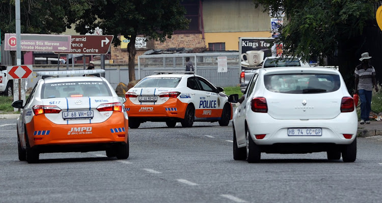 A JMPD officer was allegedly shot dead by police after she allegedly shot at them while trying to arrest her son for reckless driving.