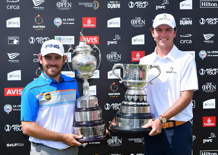 Louis Oosthuizen of South Africa nd amateur Jovan Rebula of South Africa pose with trophies after the South African Open at Randpark Golf Club on December 9, 2018 in Johannesburg, South Africa.