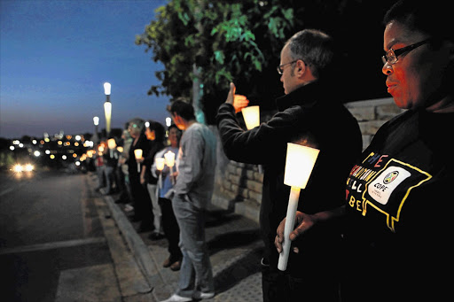 Campaigners light candles during a night vigil organised to oppose the passing of the Protection of State Information Bill outside the Constitutional Court in Johannesburg.