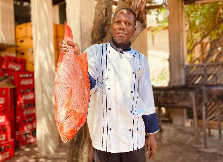 Chef Lennox displays the catch of the day at The Majlis Resort in Lamu